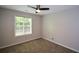 Neutral bedroom with a ceiling fan and a window letting in natural light at 3217 New Rutledge Nw Rd, Kennesaw, GA 30152