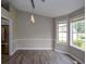 Empty dining room with ample natural light, a modern chandelier, and views of the neighborhood at 3217 New Rutledge Nw Rd, Kennesaw, GA 30152