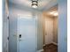 Bright entryway featuring a front door, garage access door, and updated lighting at 3217 New Rutledge Nw Rd, Kennesaw, GA 30152