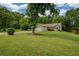 Beautiful single-story home with lush green lawn, mature trees, and a two-car garage at 3217 New Rutledge Nw Rd, Kennesaw, GA 30152