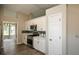 Modern kitchen with white cabinetry, stainless steel appliances, and sleek countertops at 3217 New Rutledge Nw Rd, Kennesaw, GA 30152