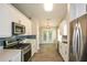 Well-equipped kitchen featuring stainless steel appliances, ample storage, and modern finishes at 3217 New Rutledge Nw Rd, Kennesaw, GA 30152