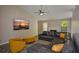 Comfortable living room with a fireplace, large sectional sofa, and bright windows at 3217 New Rutledge Nw Rd, Kennesaw, GA 30152