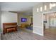 Inviting living room features a piano, comfortable seating and modern lighting at 3217 New Rutledge Nw Rd, Kennesaw, GA 30152