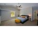 Main bedroom featuring carpet flooring, vaulted ceiling and a ceiling fan at 3217 New Rutledge Nw Rd, Kennesaw, GA 30152