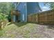 Home backyard featuring a wooden fence and access to a walkout basement at 4002 Laurel Bend Dr, Snellville, GA 30039