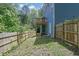 Fenced in backyard with a wooden fence and view of the wood deck at 4002 Laurel Bend Dr, Snellville, GA 30039
