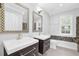 Elegant bathroom featuring dual sinks, granite countertops, and custom mirrors offering a spa-like retreat at 4002 Laurel Bend Dr, Snellville, GA 30039