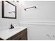 Bathroom featuring modern vanity with marble countertop and contemporary fixtures at 4002 Laurel Bend Dr, Snellville, GA 30039