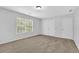 Bright bedroom with carpet, a window, and double closet doors at 4002 Laurel Bend Dr, Snellville, GA 30039