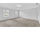 Bright bedroom featuring carpet, two windows, and crown moulding at 4002 Laurel Bend Dr, Snellville, GA 30039