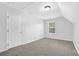 Cozy bedroom featuring plush carpet, a window with natural light, and neutral decor at 4002 Laurel Bend Dr, Snellville, GA 30039