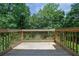 View of the wood plank deck overlooking a wooded area at 4002 Laurel Bend Dr, Snellville, GA 30039