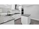 Bright kitchen with granite countertops, modern appliances, white cabinets and hardwood floors at 4002 Laurel Bend Dr, Snellville, GA 30039