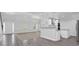 Open-concept floor plan shows combined living space of kitchen, living room, and dining area at 4002 Laurel Bend Dr, Snellville, GA 30039