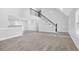 Expansive living area with a staircase, open to the kitchen, perfect for entertaining guests at 4002 Laurel Bend Dr, Snellville, GA 30039