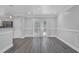Dining area features hardwood floors, stylish trim, and sliding glass doors leading to outdoor space at 4002 Laurel Bend Dr, Snellville, GA 30039