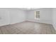 Spacious living room with tile floors and a large window providing ample natural light at 4002 Laurel Bend Dr, Snellville, GA 30039
