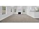 Open-concept living room with a fireplace and large windows, providing great views and natural light at 4002 Laurel Bend Dr, Snellville, GA 30039