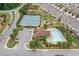Aerial view of the community featuring a pool, clubhouse, and tennis courts at 1347 Elderwood Way, Cumming, GA 30041