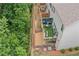 This townhome features an outdoor living space with a patio for grilling and entertaining at 1347 Elderwood Way, Cumming, GA 30041