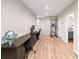 Spacious basement with desks, exercise equipment, and wood-look flooring at 1347 Elderwood Way, Cumming, GA 30041