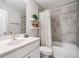 Neutral bathroom features a shower-tub combination with tiled walls and modern fixtures at 1347 Elderwood Way, Cumming, GA 30041