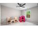 Bright playroom with a playhouse, furniture, and natural light at 1347 Elderwood Way, Cumming, GA 30041