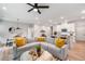 Bright open-concept living area with modern decor, stainless steel appliances, and a comfortable sectional sofa at 1347 Elderwood Way, Cumming, GA 30041