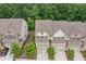 A scenic view of new townhomes with well manicured front yards and convenient parking at 1347 Elderwood Way, Cumming, GA 30041