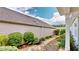 Exterior view of backyard showcasing the well manicured landscaping and attractive stone garden path at 2058 Bonneville Ln, Powder Springs, GA 30127