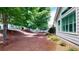 Spacious backyard with mature trees, fenced, and pine mulch at 2058 Bonneville Ln, Powder Springs, GA 30127