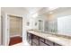 This bathroom features double sinks, granite countertops, and walk in closet at 2058 Bonneville Ln, Powder Springs, GA 30127
