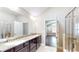 This luxurious bathroom features a granite countertop, double sinks, and an elegant shower at 2058 Bonneville Ln, Powder Springs, GA 30127