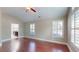 This spacious bedroom features warm hardwood floors and large windows with plantation shutters at 2058 Bonneville Ln, Powder Springs, GA 30127
