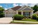 Charming single-story home featuring a well-maintained lawn, attached garage, and inviting front porch at 2058 Bonneville Ln, Powder Springs, GA 30127