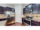 Well designed kitchen featuring stainless steel appliances and granite countertops at 2058 Bonneville Ln, Powder Springs, GA 30127