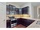 Well designed kitchen featuring stainless steel appliances and granite countertops at 2058 Bonneville Ln, Powder Springs, GA 30127