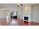 Open concept living space showcasing hardwood floors and a kitchen view at 2058 Bonneville Ln, Powder Springs, GA 30127