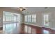 Spacious living room with hardwood floors, plantation shutters, and vaulted ceilings at 2058 Bonneville Ln, Powder Springs, GA 30127