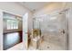This updated shower with tiled walls is conveniently located near the spacious bedroom at 2058 Bonneville Ln, Powder Springs, GA 30127