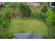 Large backyard featuring well-maintained lawn, mature trees, and a wooden fence, offering privacy and space at 2121 Silva Ct, Conley, GA 30288