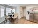 Cozy dining area with plenty of natural light, modern fixtures, and stainless steel appliances at 2121 Silva Ct, Conley, GA 30288