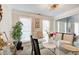 Dining room with a glass table and multiple windows letting in natural light at 2121 Silva Ct, Conley, GA 30288