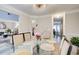 Dining room with elegant lighting, a glass table, and neutral decor for sophisticated gatherings at 2121 Silva Ct, Conley, GA 30288