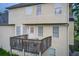 Home exterior featuring a wood patio overlooking the backyard at 2121 Silva Ct, Conley, GA 30288