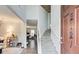Inviting foyer with a staircase, view of the living area, and a welcoming front door at 2121 Silva Ct, Conley, GA 30288