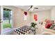Bright living room with a door to the backyard, contemporary decor and comfortable seating area at 2121 Silva Ct, Conley, GA 30288