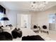 The main bedroom boasts elegant décor and a tray ceiling with a crystal chandelier at 2121 Silva Ct, Conley, GA 30288