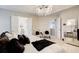 Luxurious main bedroom with a chandelier, sitting area, and double doors to the en-suite bathroom at 2121 Silva Ct, Conley, GA 30288